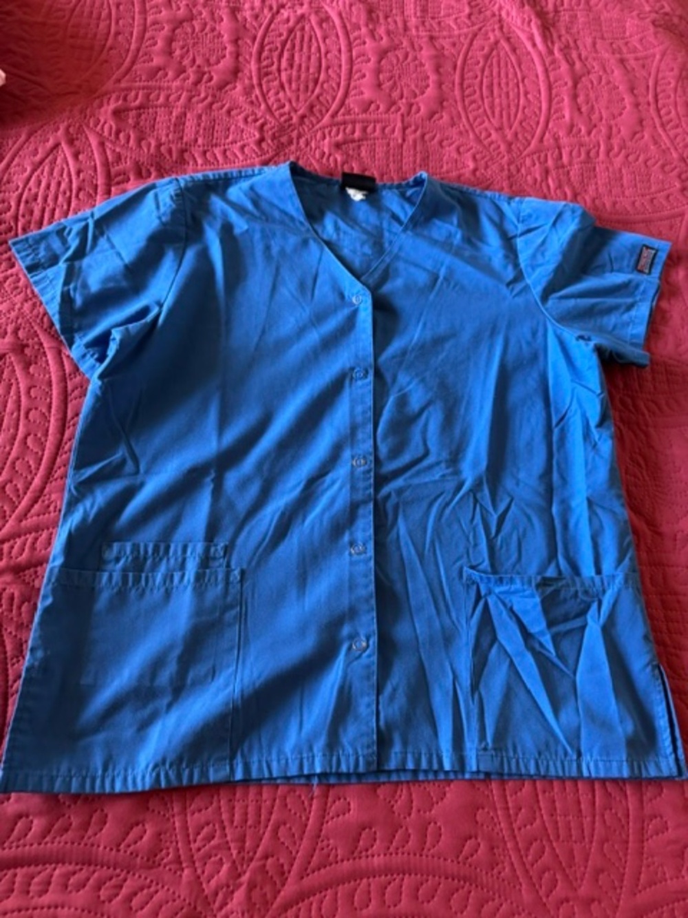 Blue scrub top /snap up front/ pockets/ medium/great condition